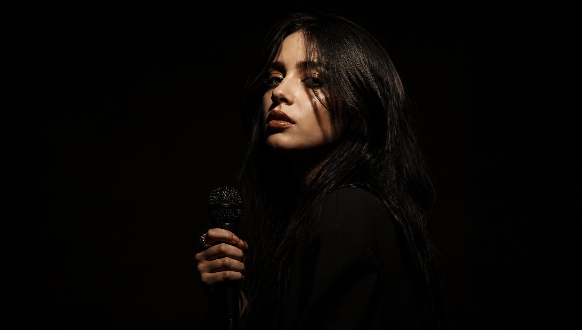 Atmospheric dark studio portrait of Ellie Gray
